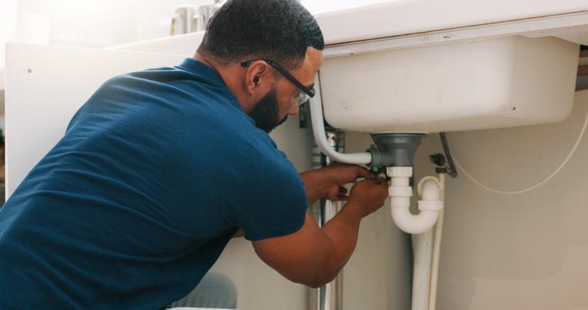 The Dr Plumber II team is fixing the basin drain pipes.